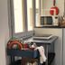 Soggiorno La Coccinella in Florence kitchen corner with microwave, sink, cabinets, and dish rack