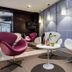 Sercotel Madrid Aeropuerto lobby lounge with sculptural chairs and side tables in Madrid