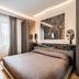 Resort Miramonti, Forte dei Marmi: modern hotel room with double bed, desk, chair, and window curtains