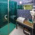 Atour Hotel Dalian Zhongshan Plaza bathroom with glass shower and sink vanity in Dalian