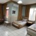Best Life Apart Hotel Alanya room with two beds, sofa, table, tiled floor and window curtains
