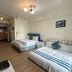 Ct Theme Suite in Kaohsiung City guest room with two beds and wood flooring