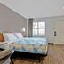 Studio 6 Ft Worth - North Richland Hills room with bed, dresser, TV and window