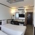Toyoko Inn Cebu in Mandaue City guest room with two twin beds, desk, TV and air conditioner