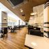 Apa Hotel & Resort Tokyo Bay Shiomi dining area with rows of tables and chairs in Tokyo