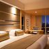 Hengshan Garden Hotel in Shanghai guest room with large window city view and desk seating
