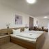 Hotel Engel in Kappel-Grafenhausen guest room with double bed, desk, wooden dresser and large windows