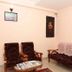 Karthika Residency, Munnar: modest lobby seating with armchairs, sofa, and coffee table