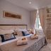 Heritage Hotel Antique Split room with twin beds and tall windows in Split