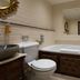 The Coal Exchange Hotel Cardiff bathroom with bathtub, toilet, sink and wall mirror
