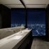 Bellustar Tokyo, A Pan Pacific Hotel bathroom with double vanity and Tokyo skyline view