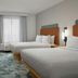Hampton Inn & Suites Phoenix Chandler-Fashion Center guest room with two beds and a city view