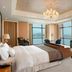 The Westin Wuhan Wuchang room with city and river views, chaise lounge, and TV