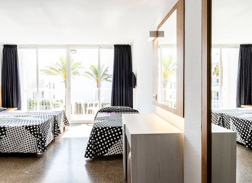 Ibiza Rocks Hotel in Sant Antoni de Portmany guest room with twin beds and balcony doors