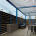 Tru by Hilton Austin Airport patio with pergola, seating and outdoor bar in Austin
