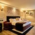 Muthu Ben Doran Hotel, Crianlarich: cozy guest room with double bed, wall TV, chair, and window light
