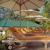 The Palm Seychelles in Bel Ombre: poolside sun loungers and umbrellas beside the pool
