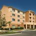 Courtyard by Marriott San Antonio Lackland exterior, tan multi-story hotel with covered entrance in San Antonio