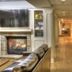 Lodge at Five Oaks Pigeon Forge lobby hallway with fireplace, leather seating, and framed wall art