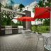 Home2 Suites by Hilton Arundel Mills BWI Airport in Hanover patio with red umbrellas and grill