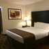 Boarders Inn & Suites by Cobblestone Hotels - Ashland City guest room with king bed and bedside lamps