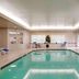 Residence Inn by Marriott Portsmouth indoor pool with lounge chairs and tables