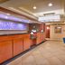 Fairfield Inn & Suites by Marriott Boise Nampa lobby with front desk and blue chairs in Nampa