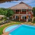 Scent of Green Papaya in Panglao with thatched villa, outdoor pool, and garden loungers
