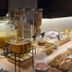 Hôtel L'Europe Cholet breakfast buffet with juice dispensers, fruit basket, cereal jars and bread
