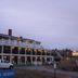Windjammer BY The Sea in Hampton with lit oceanfront resort exterior at dusk