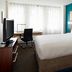Residence Inn by Marriott Montreal Downtown guest room with queen bed, desk, chair and TV