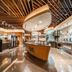 New Century Hotel Pudong Shanghai lobby with sleek wood ceiling, central buffet island and polished floors in Shanghai