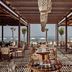 The Royal Senses Resort & Spa Crete, Curio Collection by Hilton in Panormos: beachfront restaurant with sea views