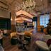 Moxy NYC Lower East Side lobby with chandeliers, bar seating, and lounge chairs in New York