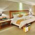 Gentl Grown Sanya Seashore in Sanya guest room with king bed, balcony sea view, and seating area