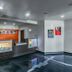 Motel 6 Augusta KS lobby with front desk and gray flooring in Augusta