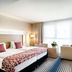 Best Western Plus Welcome Hotel Frankfurt guest room with twin beds, desk, and large window in Frankfurt am Main