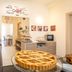 Bb Dolce Luna Florence breakfast room with coffee station, pastries and a large lattice-topped tart