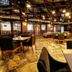 Welcome Hotel at Srinagar restaurant with wooden tables, chairs, and warm ceiling lights