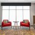 Seating area at Hampton Inn Santa Clarita-Valencia with red chairs and a small table by a window