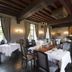 Romantik Hotel Kasteel Daelenbroeck in Herkenbosch dining room with set tables and dark wood beams