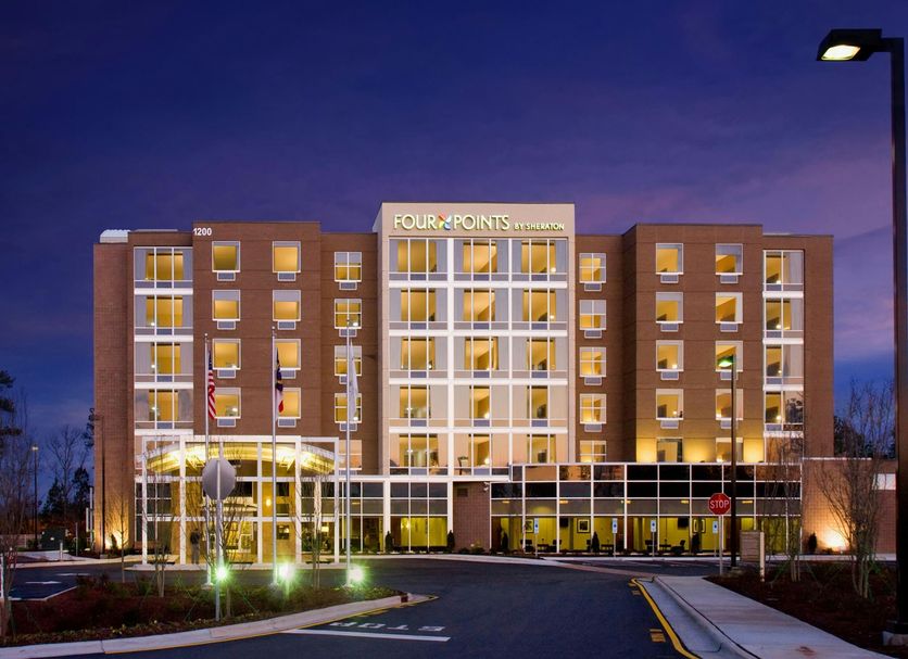 Four Points by Sheraton Raleigh Durham Airport in Morrisville at dusk, exterior hotel entrance lit up