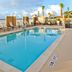 TownePlace Suites by Marriott Fort Walton Beach-Eglin AFB rooftop pool with lounge chairs and ocean view