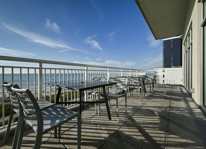 Residence Inn by Marriott Myrtle Beach Oceanfront balcony with tables and chairs overlooking the ocean