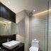 Golden Peak Hotel & Suites powered by Cocotel bathroom in Cebu City with glass shower, sink, and toilet