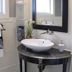 The Connecticut River Valley Inn in Glastonbury bathroom with vessel sink, mirror and window