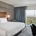 Courtyard by Marriott Los Angeles Sherman Oaks guest room with balcony city view and work desk