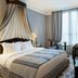 Le Dokhan's, Paris Arc de Triomphe, a Tribute Portfolio Hotel guest room with canopy bed and window seating