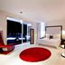 In Fashion Hotel & Spa, Playa del Carmen room with red rug, modern bed and open balcony view