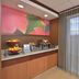 Fairfield Inn and Suites by Marriott Williamsport breakfast area with fruit display and large window